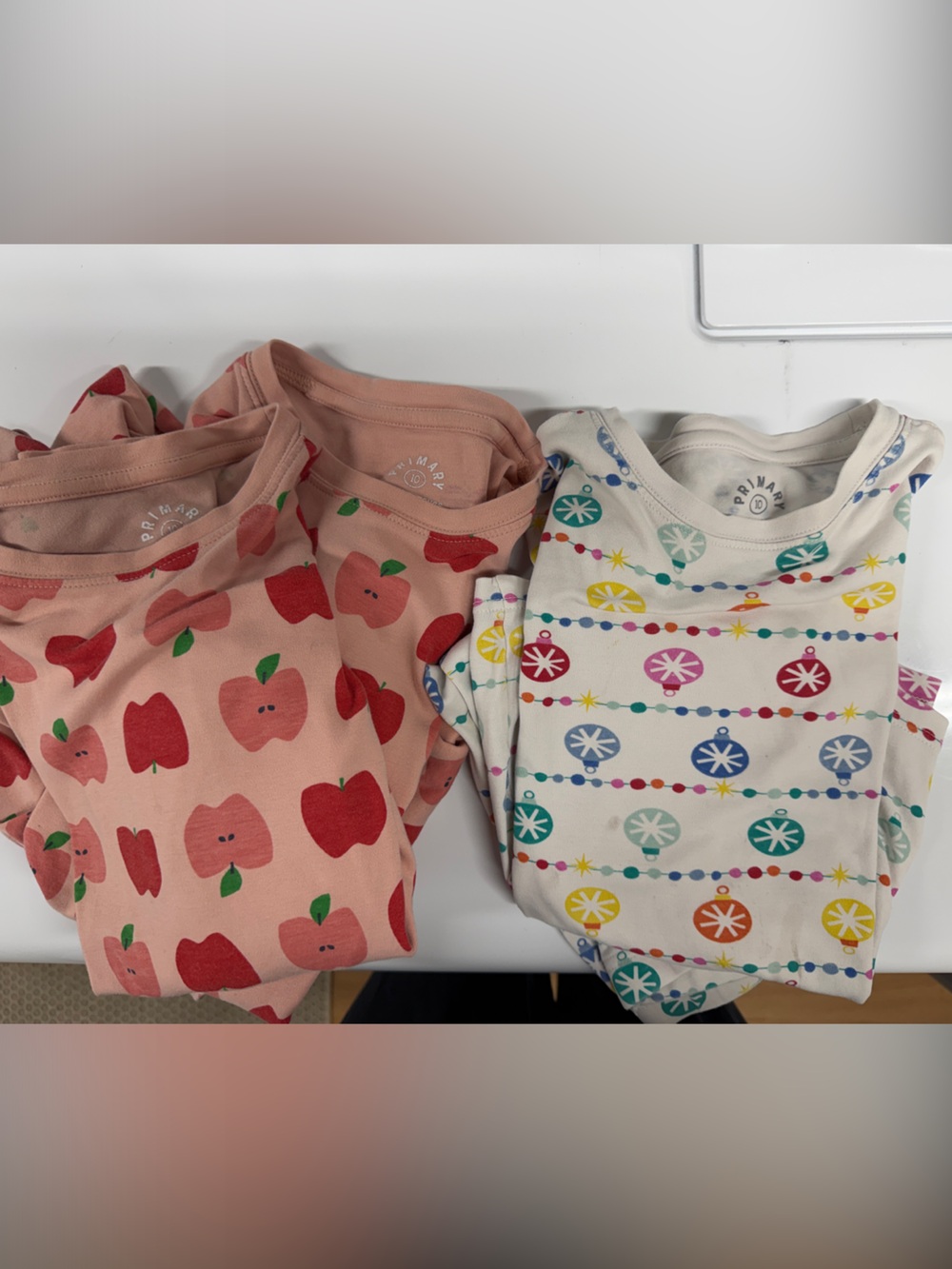 Primary Kids Size 10 Pajamas. Three sets - 2 Apple and 1 Holiday Print